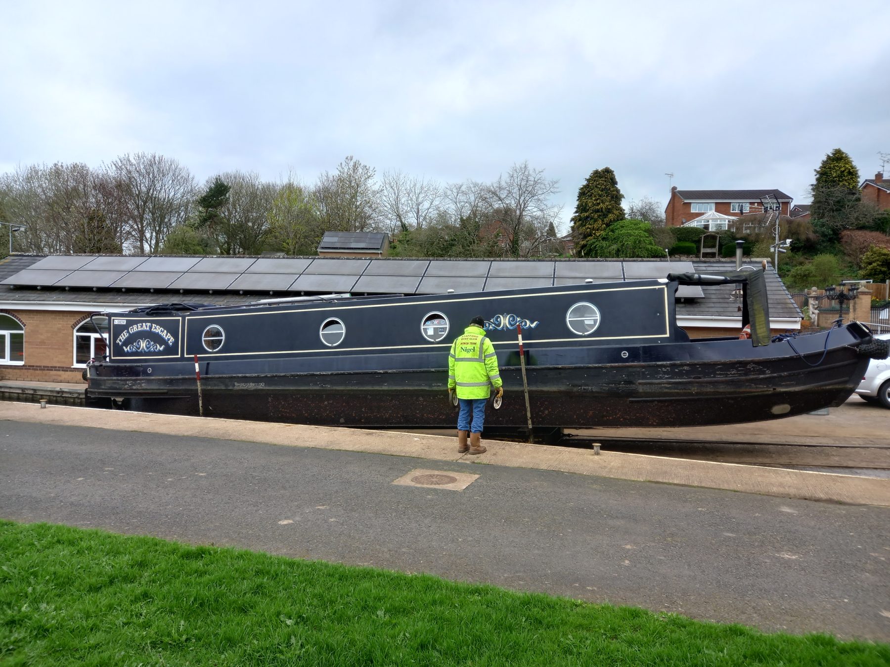 A boat lifted clear of the water on the club slipway